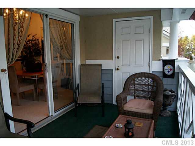 19823 Henderson Road, Unit E Cornelius, NC 28031 - Photo 12 of 14 a view of a livingroom with furniture and front door