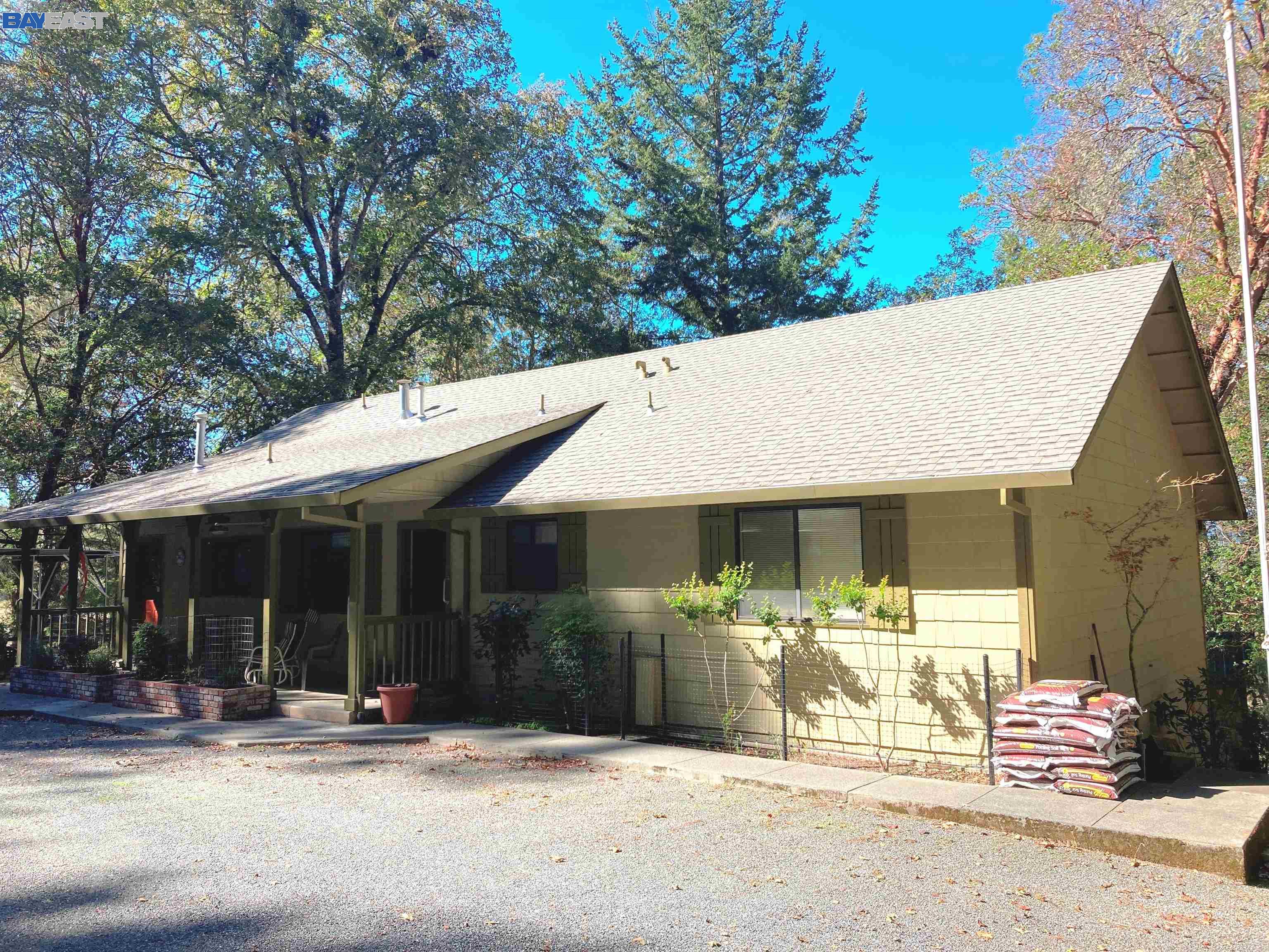 23391 Eastside Road Willits, CA 95490 - Photo 1 of 1 a front view of a house with a patio