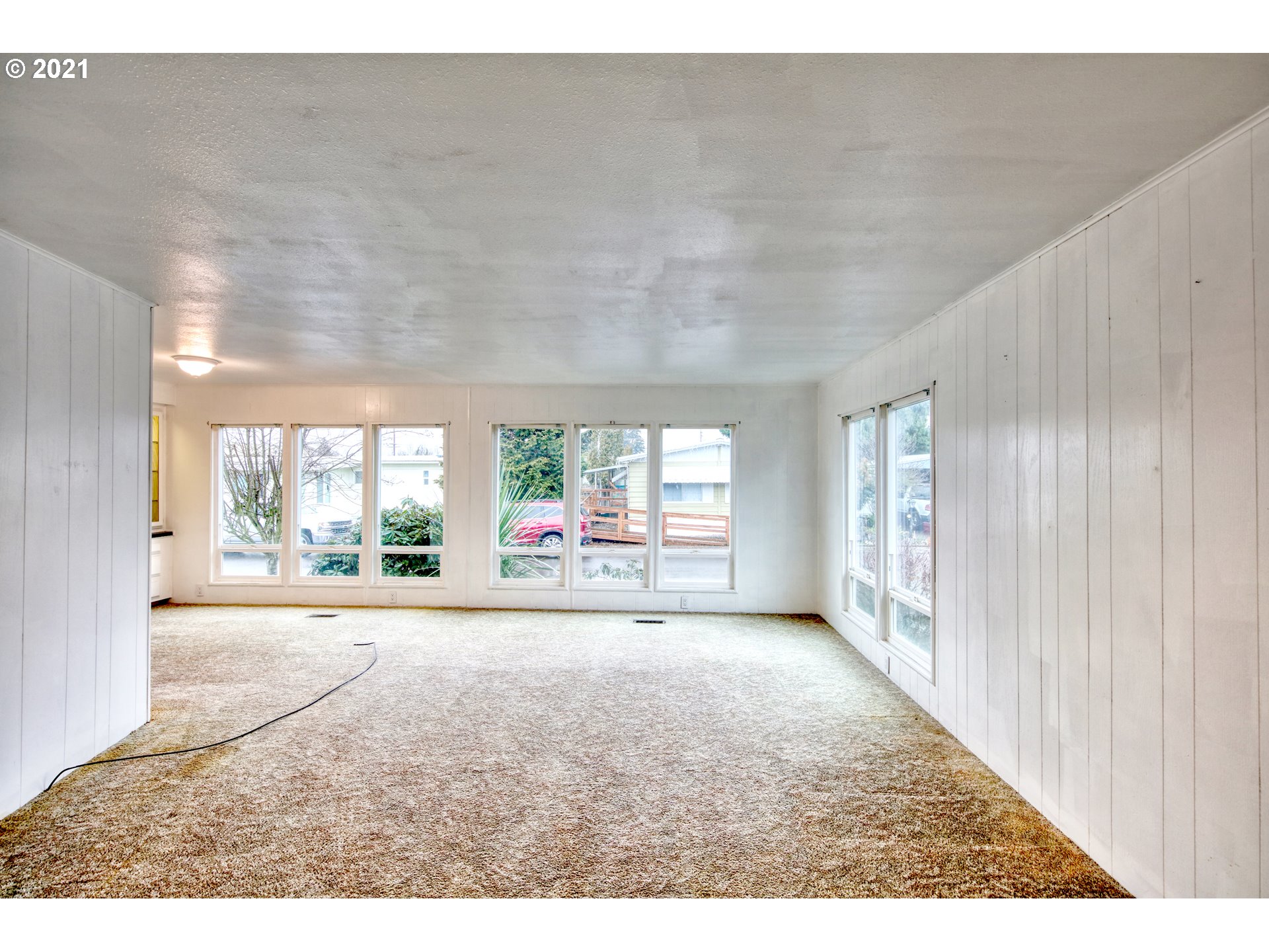 3530 Game Farm Road, Unit 46 Springfield, OR 97477 - Photo 11 of 32 a view of a big room with wooden floor and windows