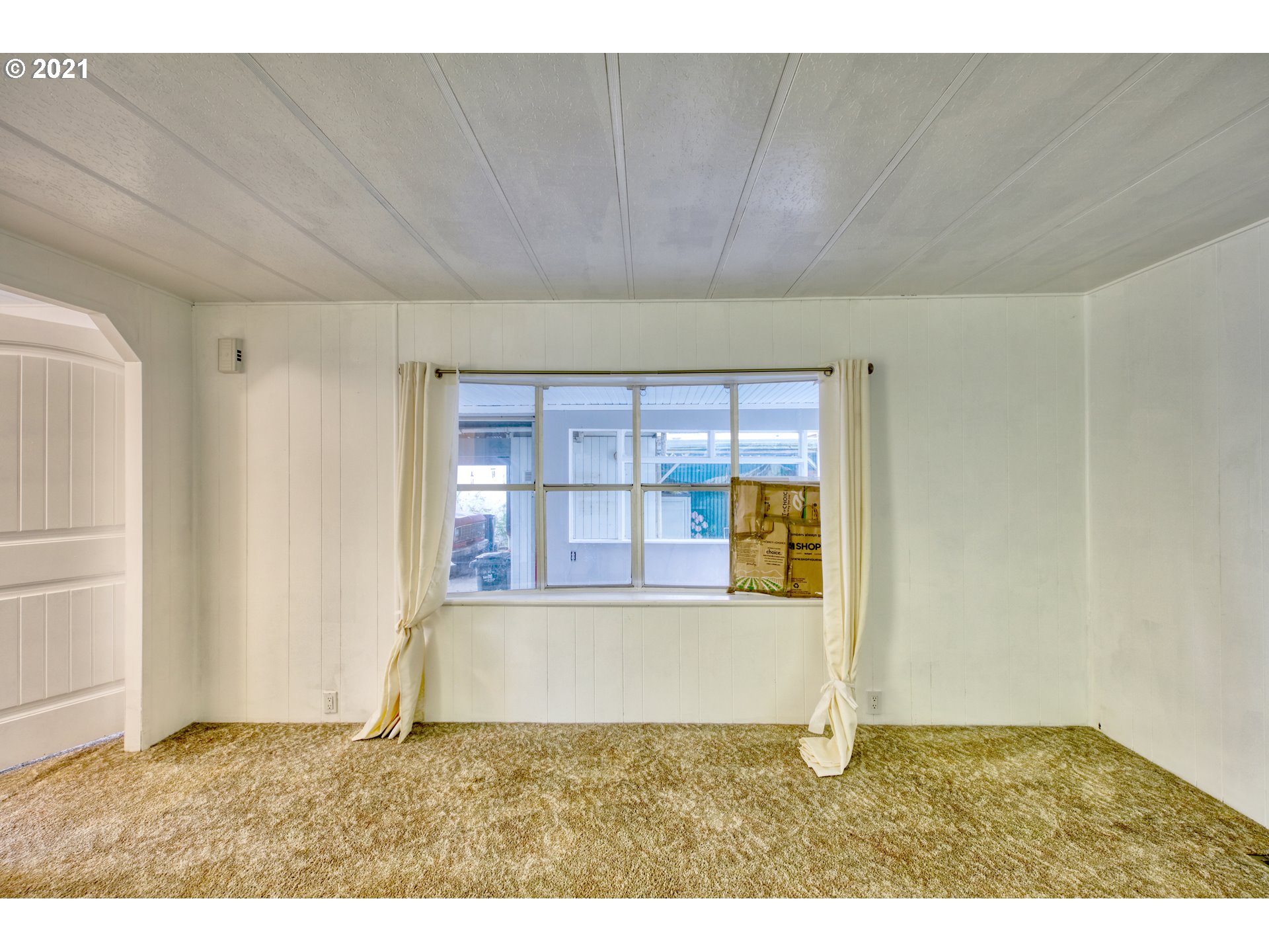 3530 Game Farm Road, Unit 46 Springfield, OR 97477 - Photo 21 of 32 a view of an empty room with a window
