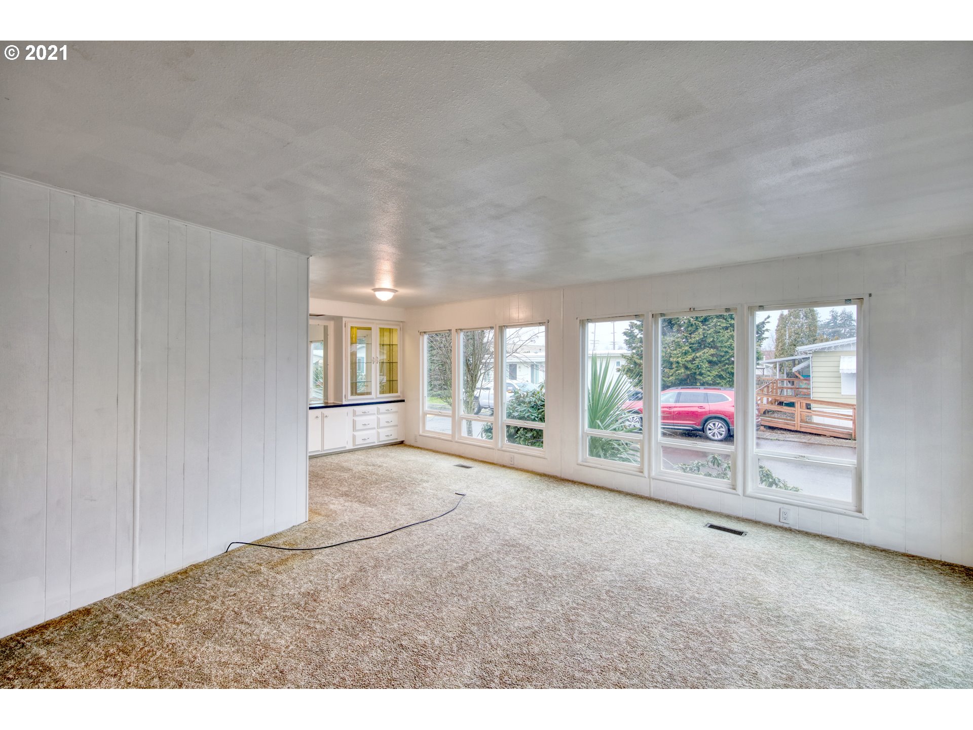 3530 Game Farm Road, Unit 46 Springfield, OR 97477 - Photo 10 of 32 a view of a livingroom with wooden floor and window