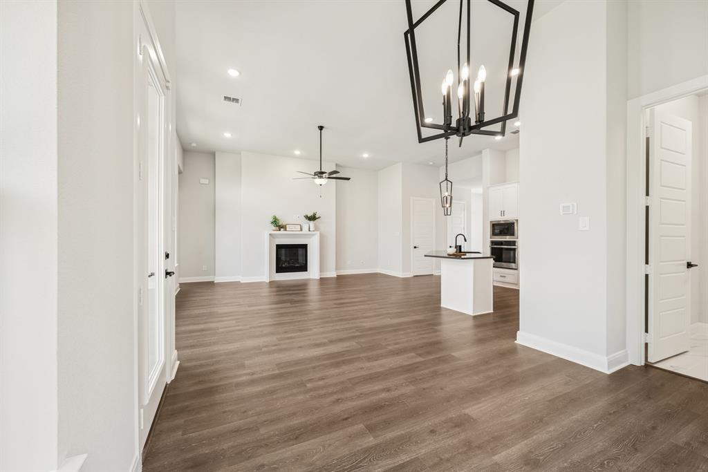 2065 Spotted Fawn Drive Arlington, TX 76005 - Photo 19 of 27 a view of a kitchen with a sink and wooden floor
