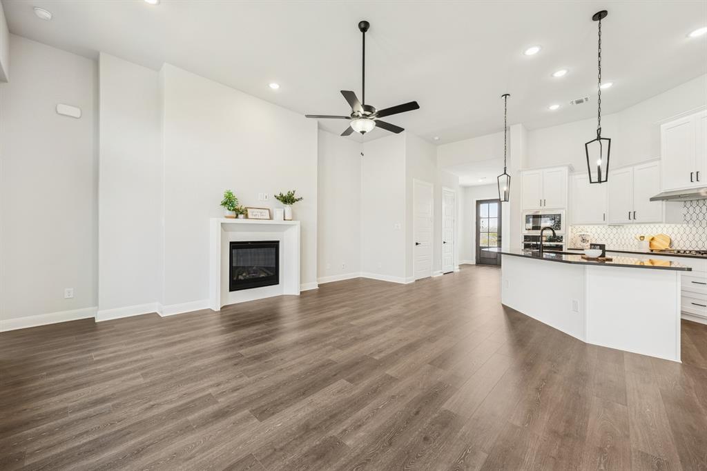 2065 Spotted Fawn Drive Arlington, TX 76005 - Photo 21 of 27 a view of a kitchen with a sink a ceiling fan and stainless steel appliances