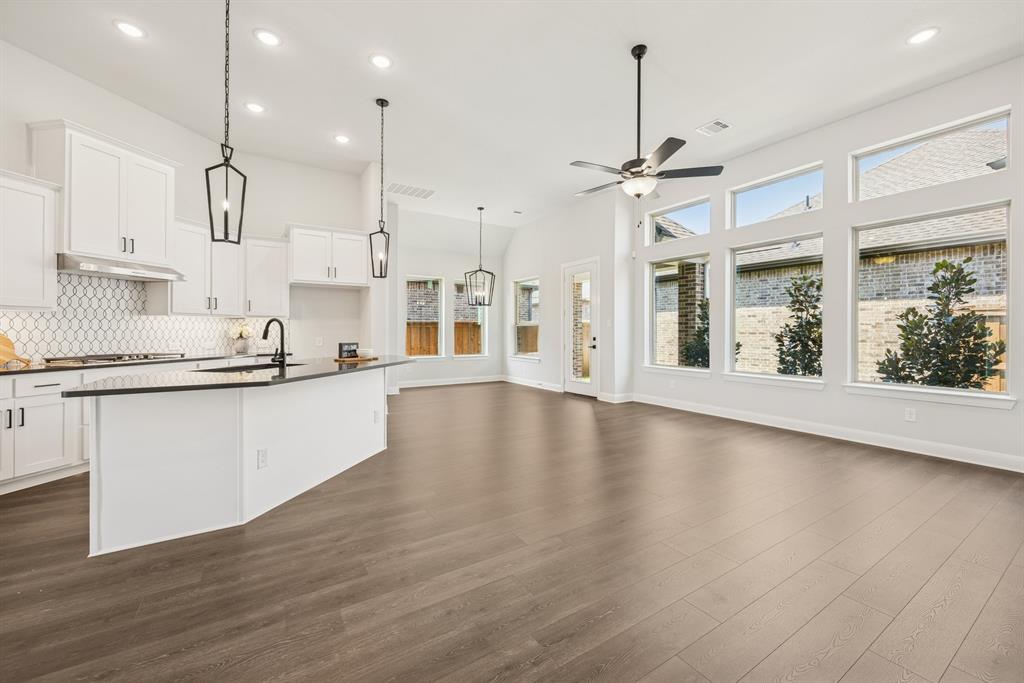 2065 Spotted Fawn Drive Arlington, TX 76005 - Photo 23 of 27 a view of large kitchen with granite countertop a stove a sink and a wooden floors