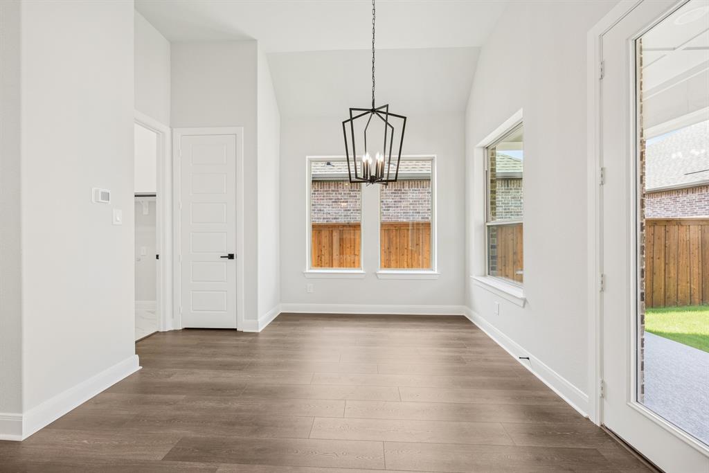 2065 Spotted Fawn Drive Arlington, TX 76005 - Photo 7 of 27 a view of empty room with wooden floor and fan