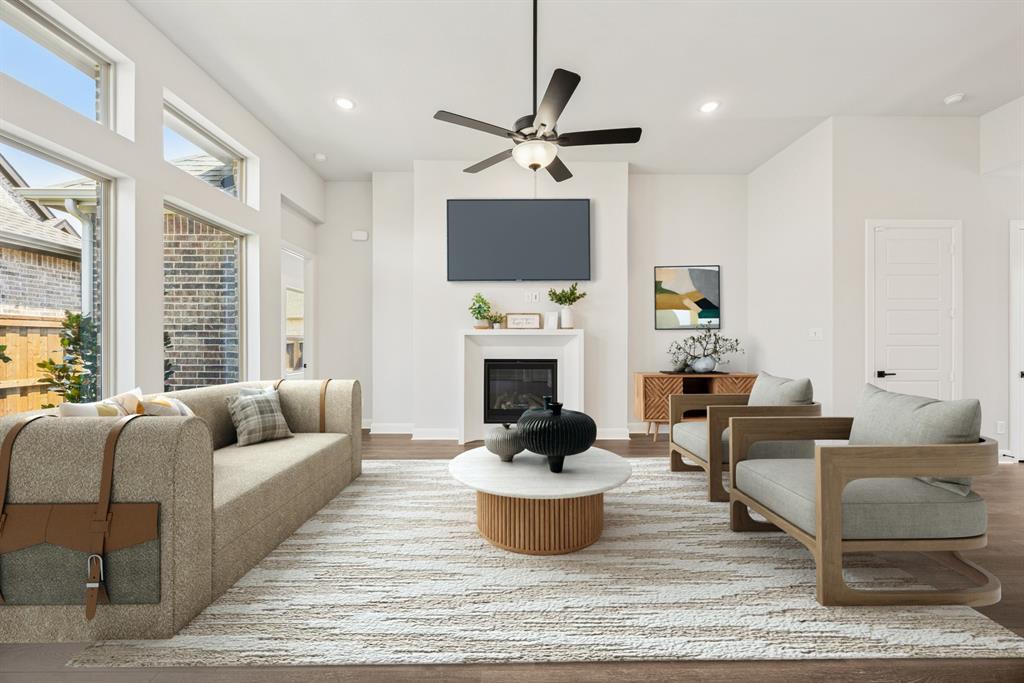 2065 Spotted Fawn Drive Arlington, TX 76005 - Photo 8 of 27 a living room with furniture a fireplace and a flat screen tv