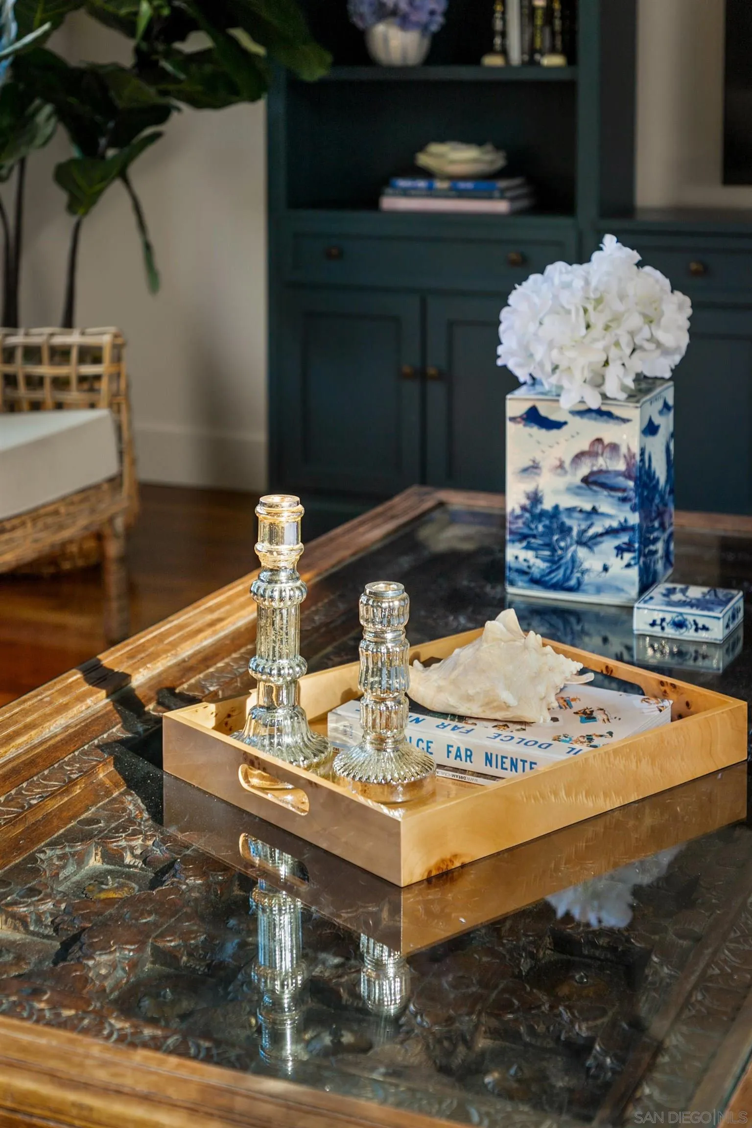 2122 Paseo Dorado La Jolla, CA 92037 - Photo 12 of 31 a dining table with white cabinets and couches with wooden floor