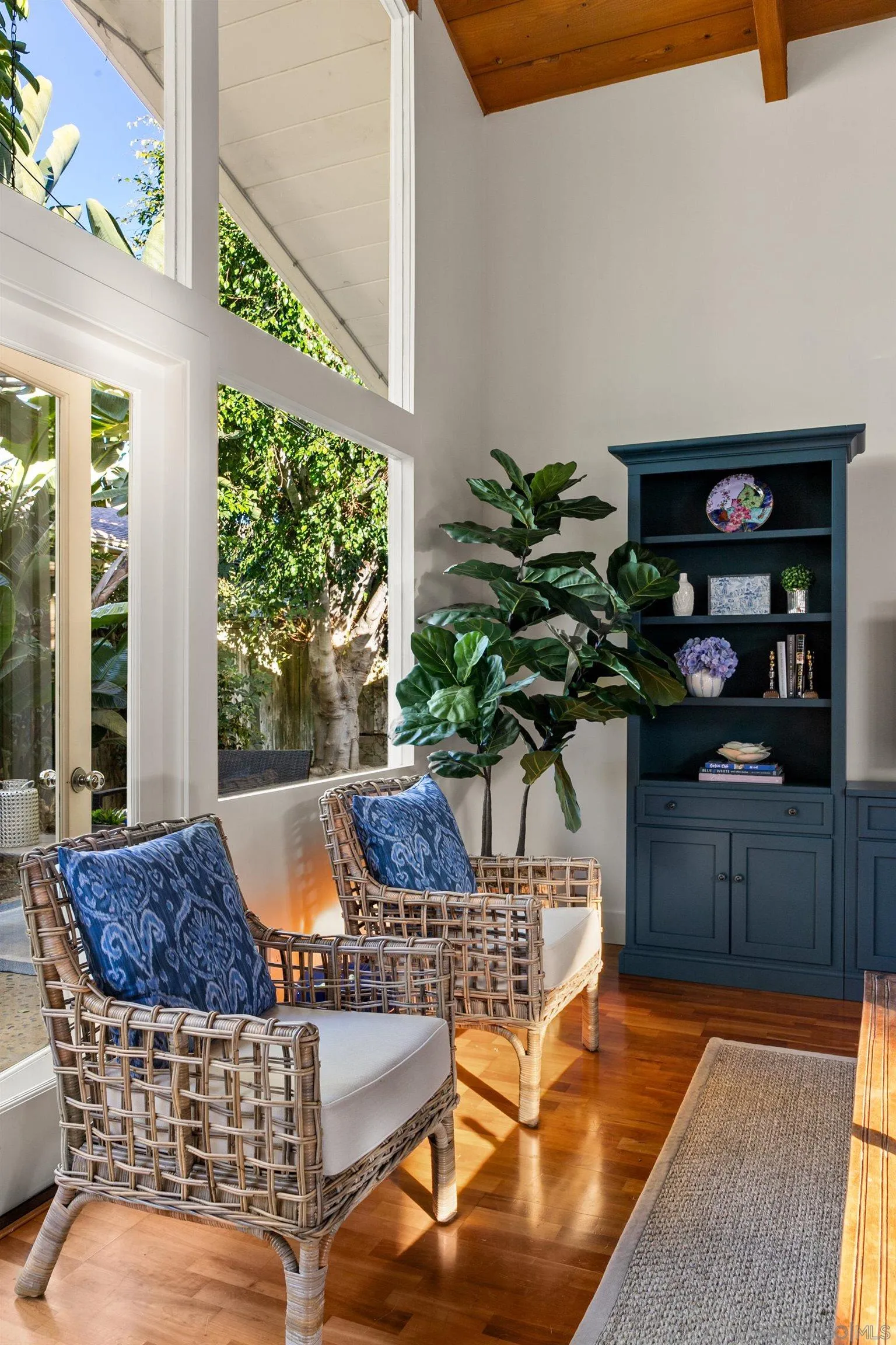 2122 Paseo Dorado La Jolla, CA 92037 - Photo 13 of 31 a vase of flowers sitting on a table in front of a window