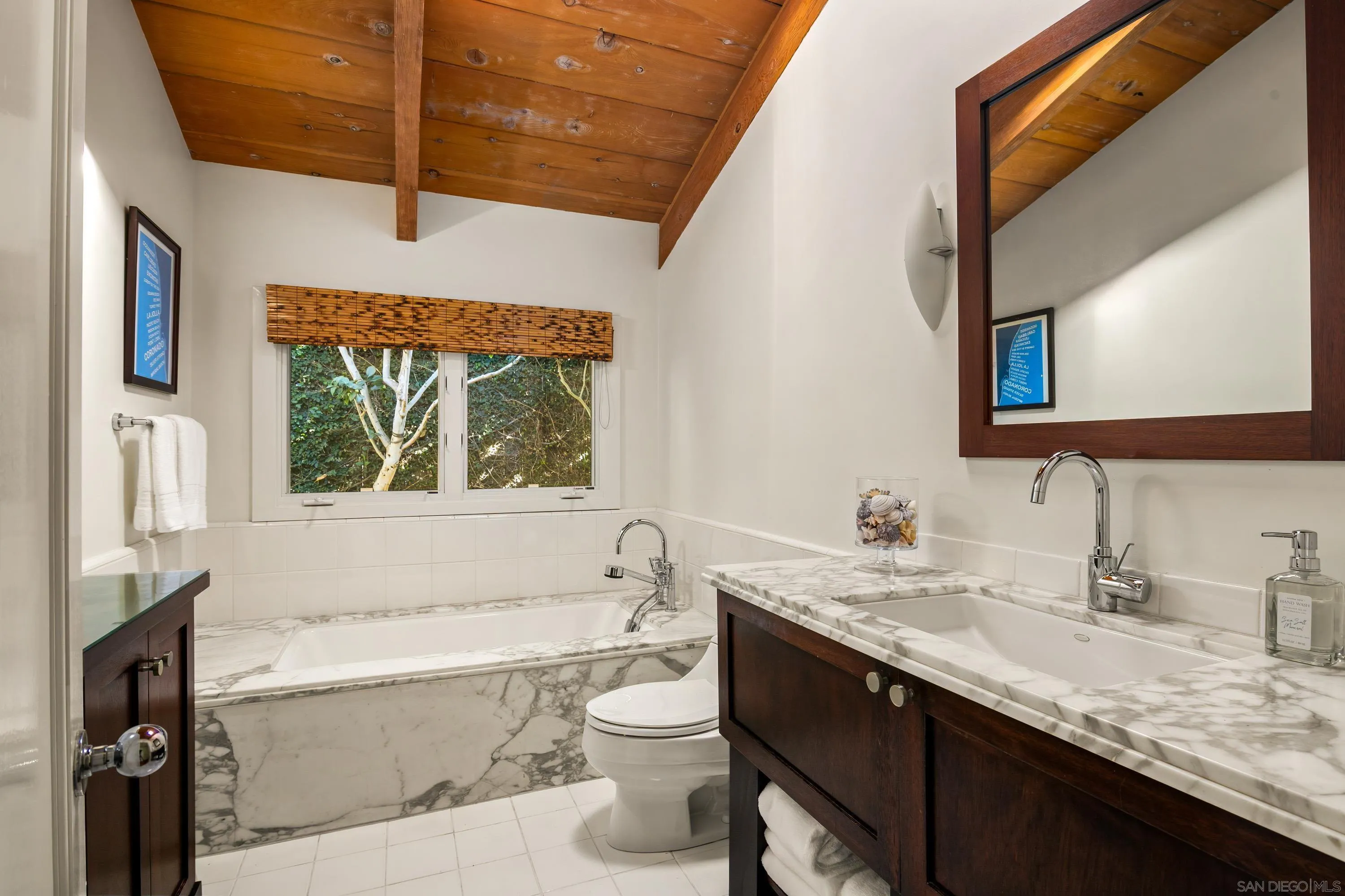 2122 Paseo Dorado La Jolla, CA 92037 - Photo 17 of 31 a bathroom with a granite countertop bathtub sink vanity mirror and toilet