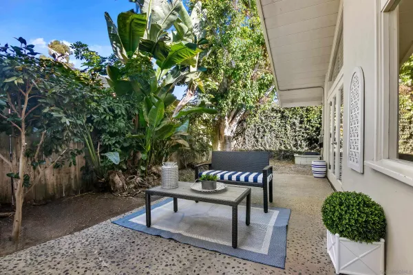 a view of a backyard with sitting area