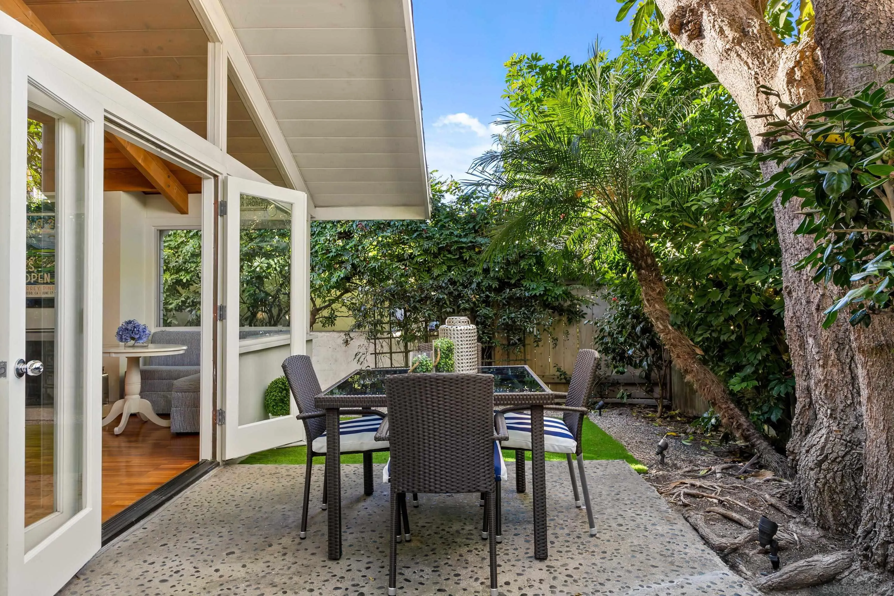 2122 Paseo Dorado La Jolla, CA 92037 - Photo 25 of 31 a view of a patio with table and chairs and potted plants
