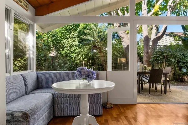 a view of a patio with a table and chairs