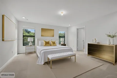 a bedroom with furniture and a window