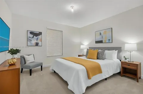 a swimming pool with outdoor seating and yard