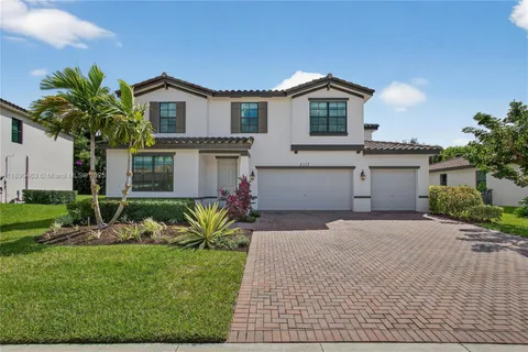 a view of a backyard with sitting area