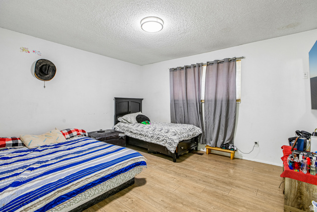 768 300 North Provo, UT 84606 - Photo 45 of 51 Recessed ceiling light, wood-finish flooring, and window with curtains