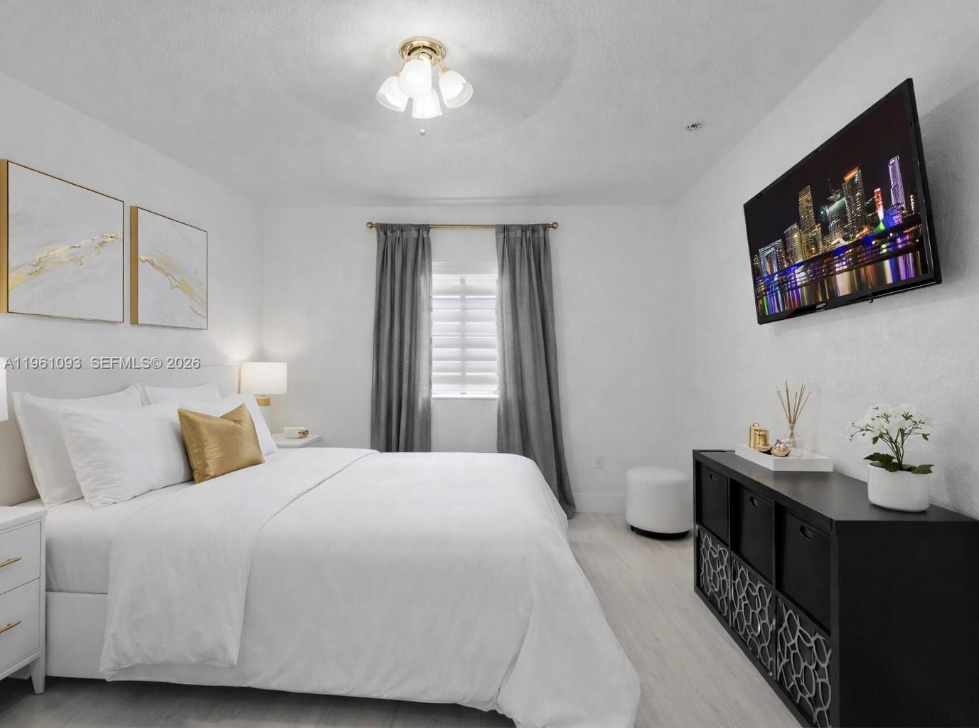 14214 Southwest 289th Terrace Homestead, FL 33033 - Photo 11 of 13 a bedroom with a bed and a flat screen tv