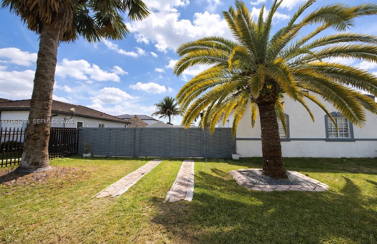 14214 Southwest 289th Terrace Homestead, FL 33033 - Photo 2 of 13 a view of a backyard with a plants