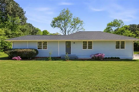 front view of a house with a yard