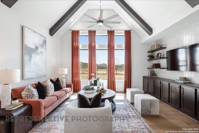 a living room with furniture and a large window