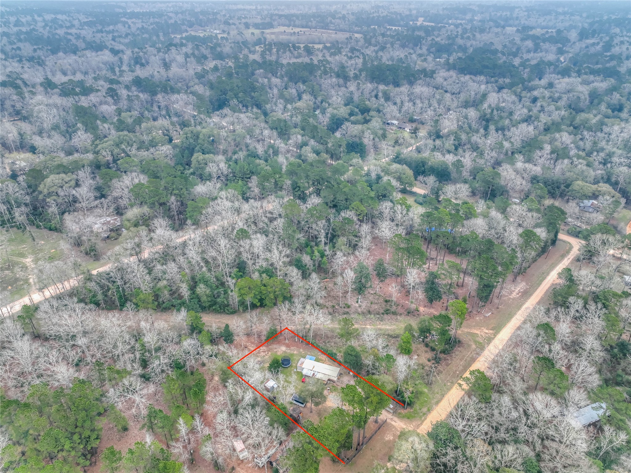 713 Garrett Road Livingston, TX 77351 - Photo 40 of 40 a aerial view of a house with a yard