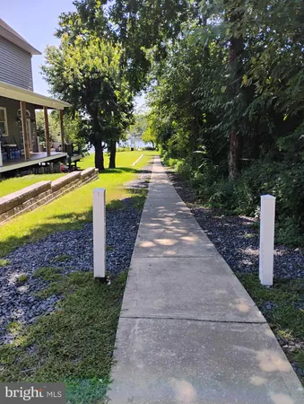 a view of a lake with houses in the background