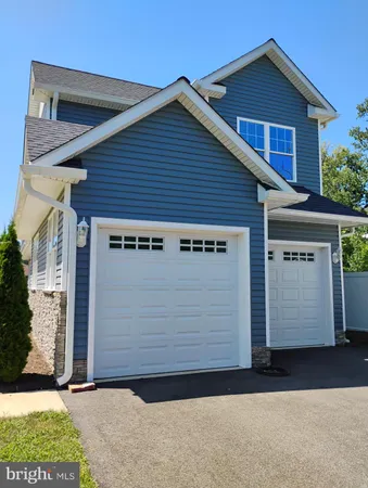 a front view of a house with a garage