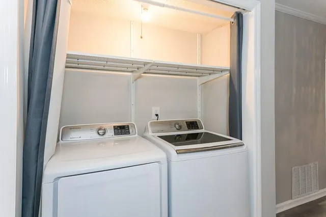 a utility room with dryer and washer
