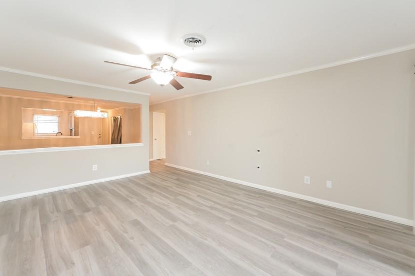2505 West Broad Street, Unit 122 Athens, GA 30606 - Photo 3 of 15 wooden floor in an empty room with a window