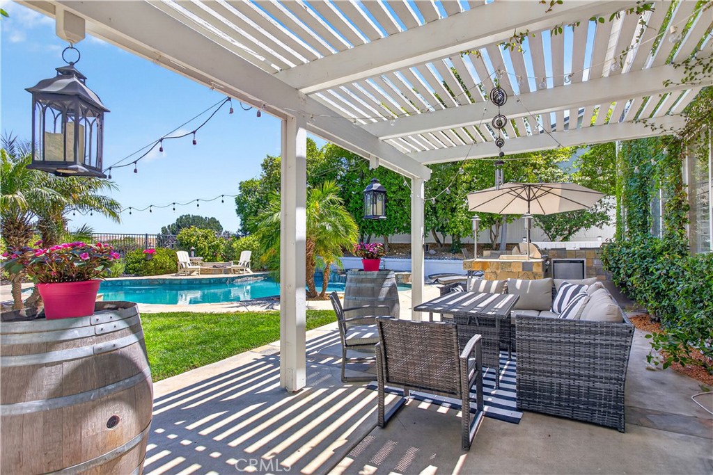 31928 Cercle Chambertin Temecula, CA 92591 - Photo 57 of 74 a view of a patio with a table chairs and a yard