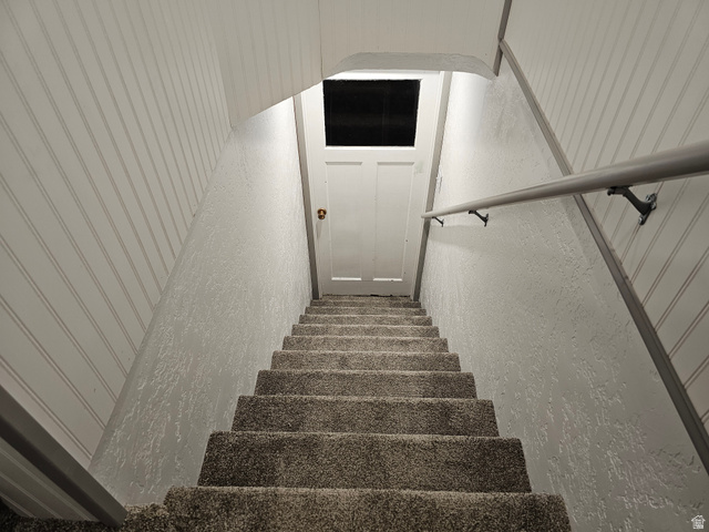 744 Royal Street Helper, UT 84526 - Photo 20 of 33 Stairs with a textured wall