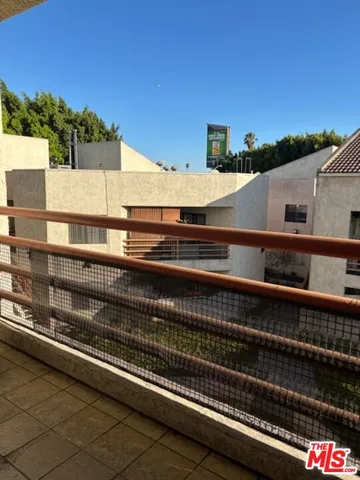 a view of a balcony with an outdoor space