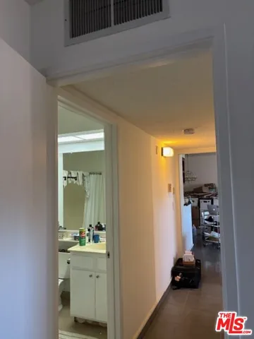 a room with gym equipment and a mirror