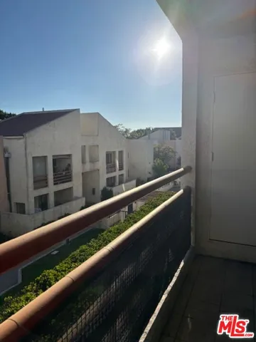 a view of balcony with furniture