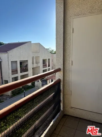 a view of a balcony with city view