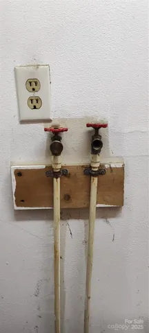 a kitchen with a table and chairs in it