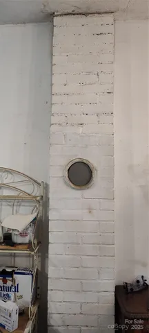 a view of backyard with wooden floor and fence