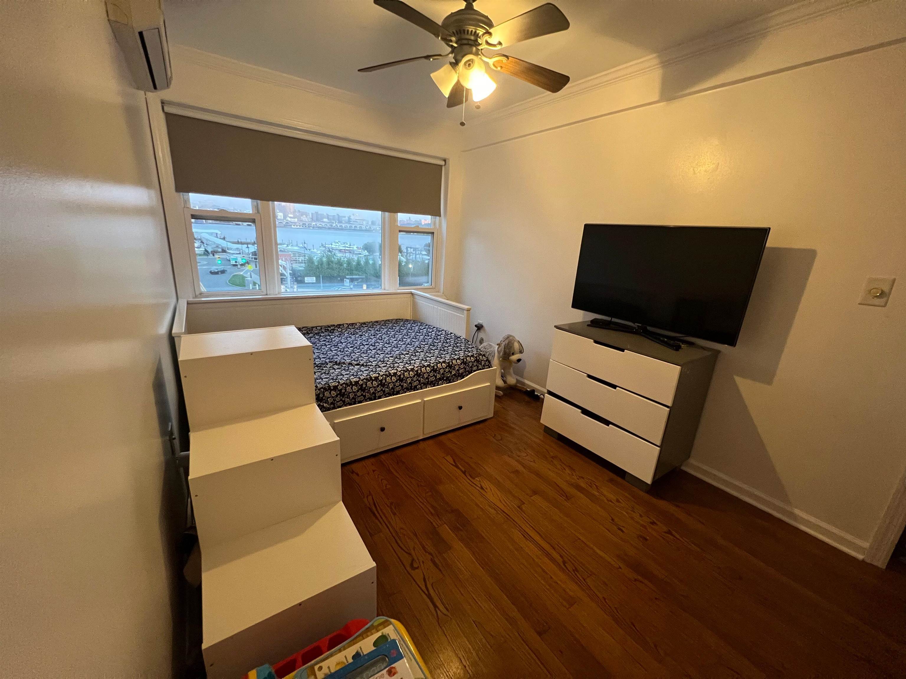 11 Beverly Place, Unit 1 Edgewater, NJ 07020 - Photo 16 of 18 a bedroom with bed and window