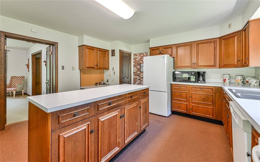 2371 Oakview Drive Pittsburgh, PA 15237 - Photo 12 of 25 a kitchen with stainless steel appliances a refrigerator and a stove top oven