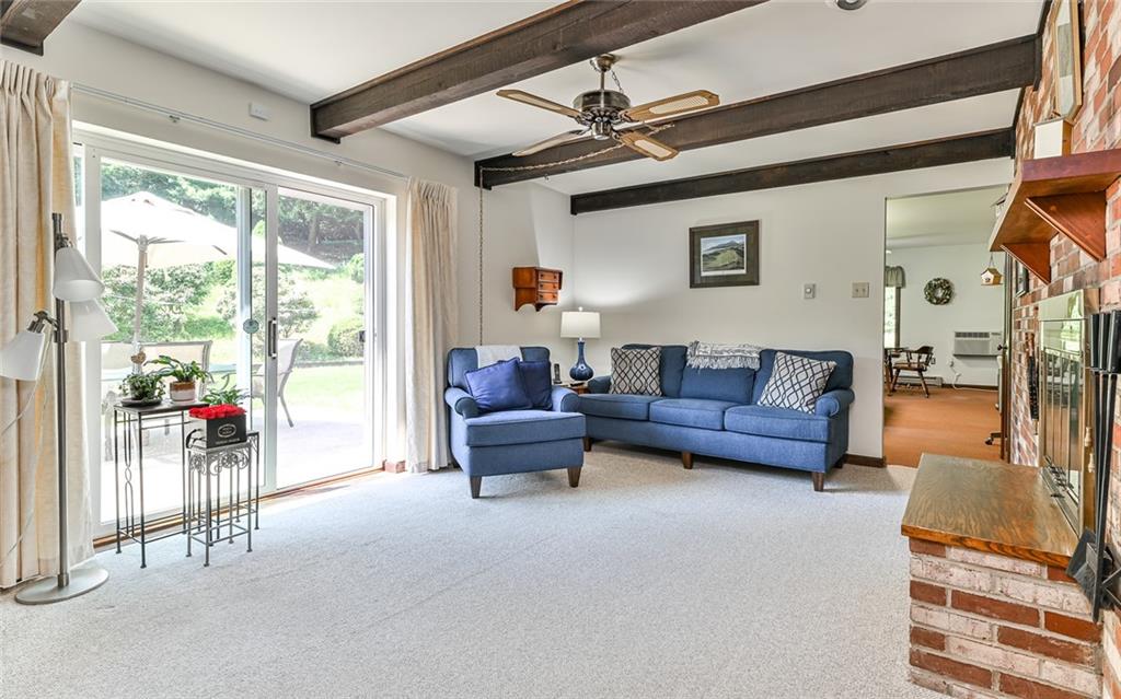 2371 Oakview Drive Pittsburgh, PA 15237 - Photo 15 of 25 a living room with furniture and a floor to ceiling window