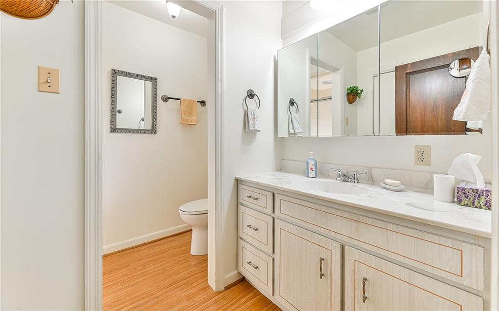 2371 Oakview Drive Pittsburgh, PA 15237 - Photo 18 of 25 a bathroom with a granite countertop toilet sink and mirror
