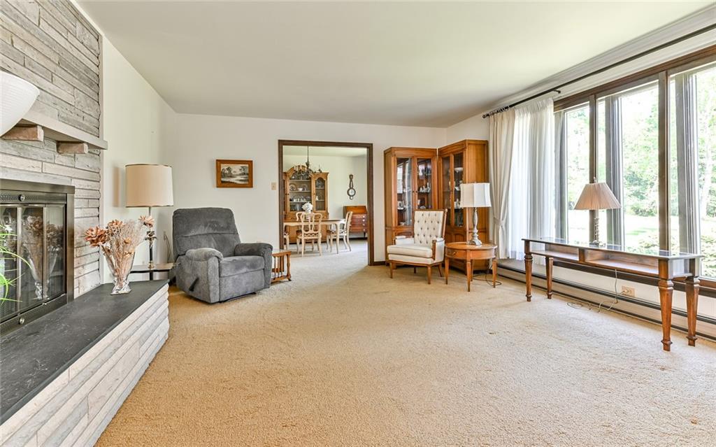 2371 Oakview Drive Pittsburgh, PA 15237 - Photo 8 of 25 a living room with furniture and a flat screen tv