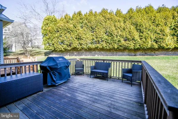 a dining room with furniture a fireplace and wooden floor
