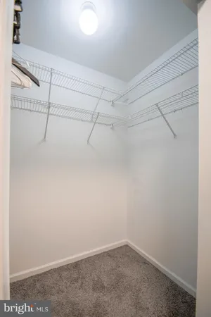 a bedroom with a bed and a cabinets