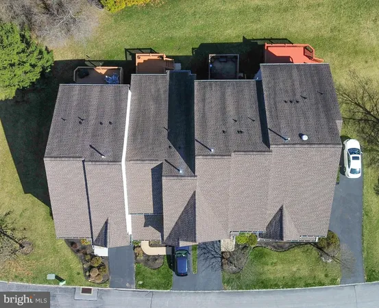 an aerial view of houses with outdoor space