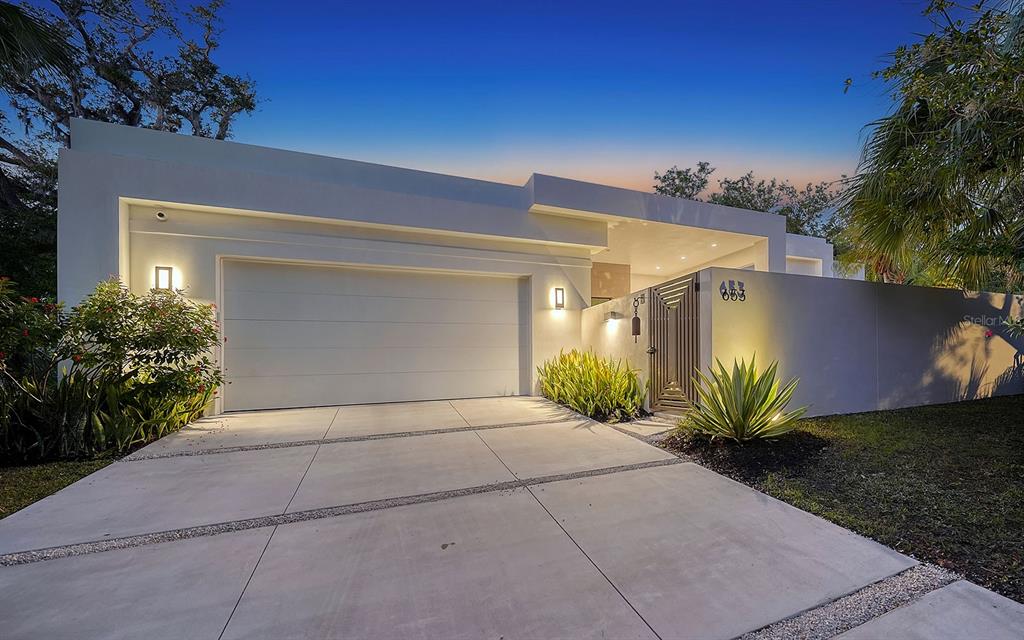 653 40th Street Sarasota, FL 34234 - Photo 1 of 1 a view of a house with a yard and potted plants