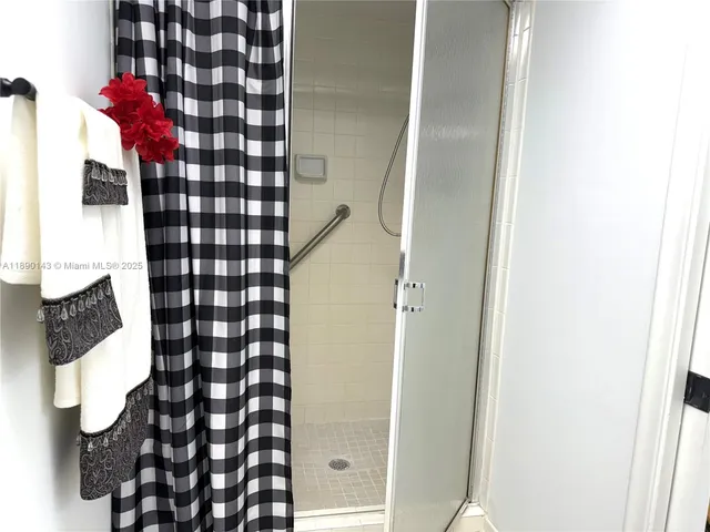 an empty room with a window and wooden floor