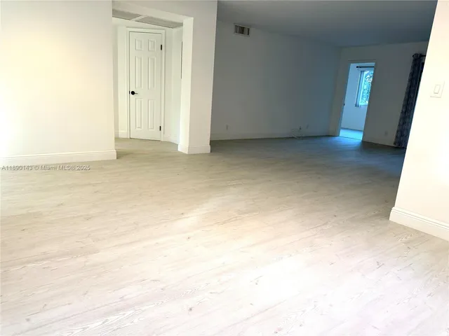 a view of a building with a yard