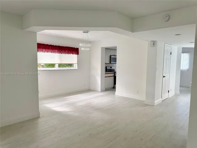 an aerial view of a houses with outdoor space and trees