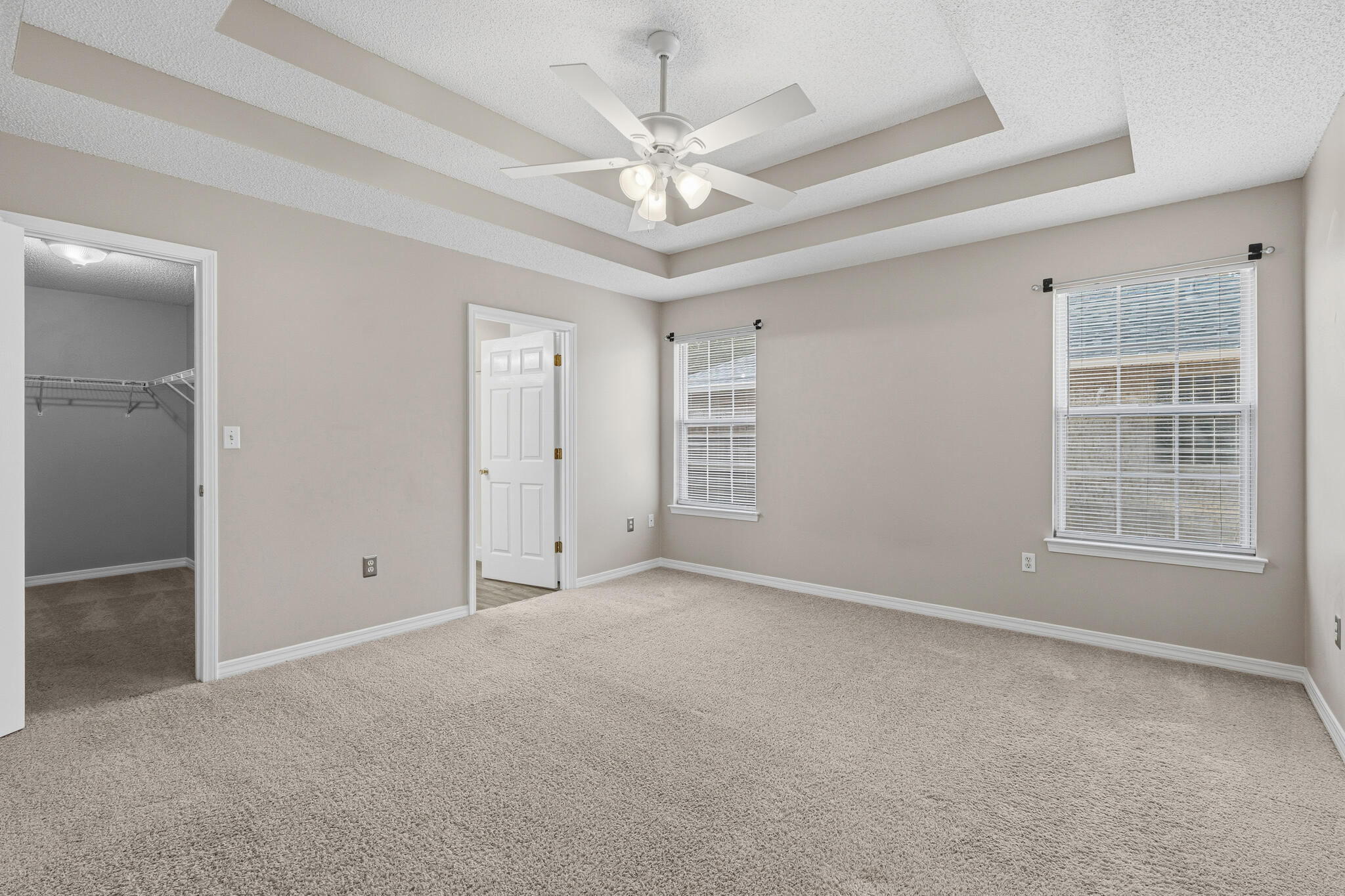 643 Alysheba Drive Crestview, FL 32539 - Photo 18 of 36 an empty room with windows and ceiling fan